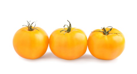 Fresh ripe yellow tomatoes on white background