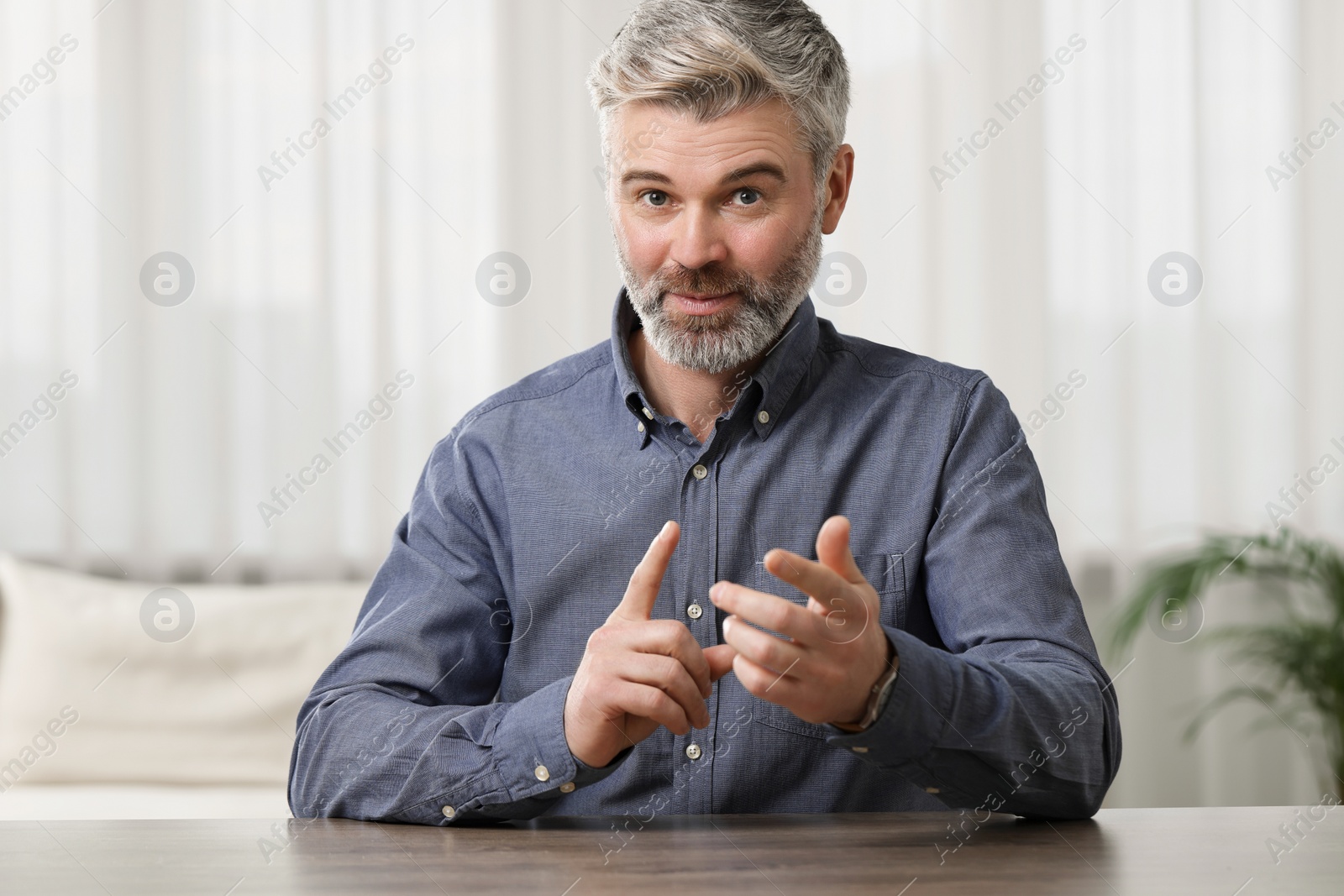 Photo of Happy man having video call at home, view from web camera