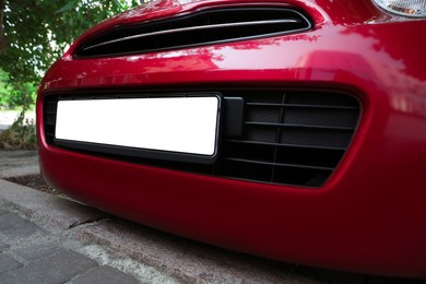 Photo of Car with vehicle registration plate outdoors, closeup. Mockup for design