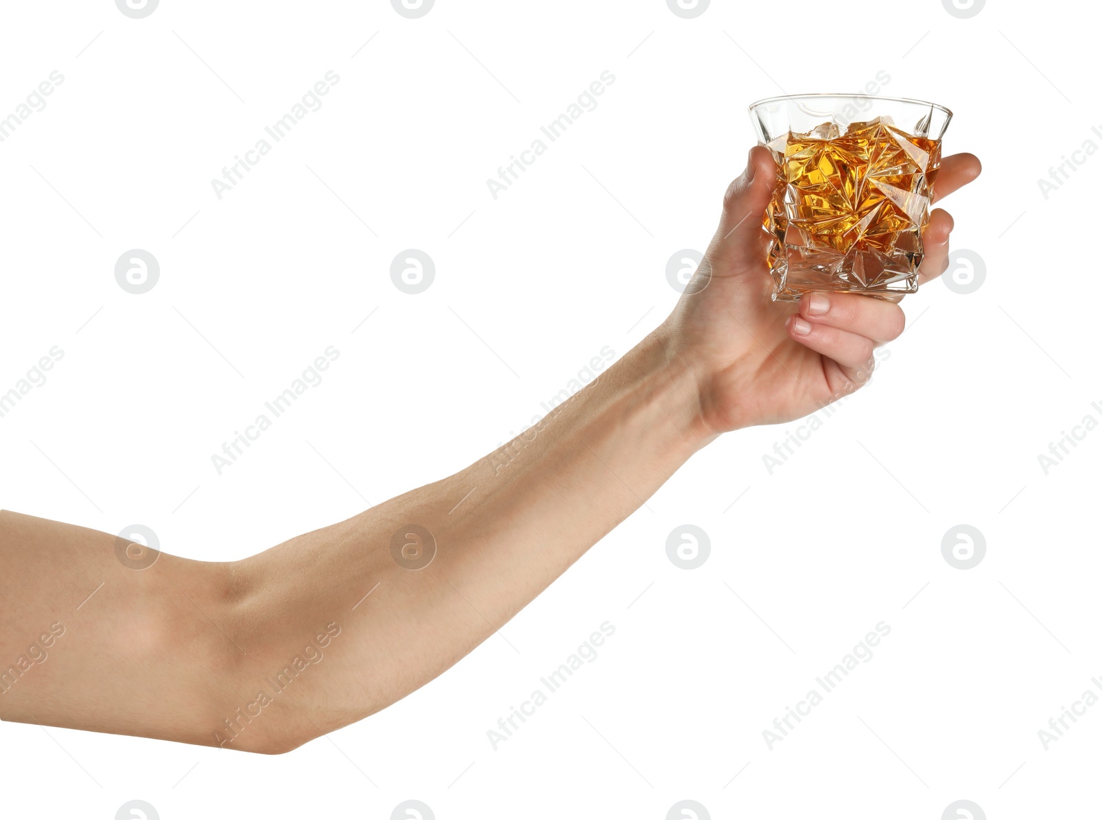 Photo of Man holding glass of whiskey with ice cubes on white background, closeup