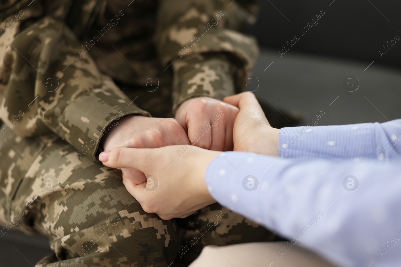 Photo of Psychotherapist working with military woman in office, closeup