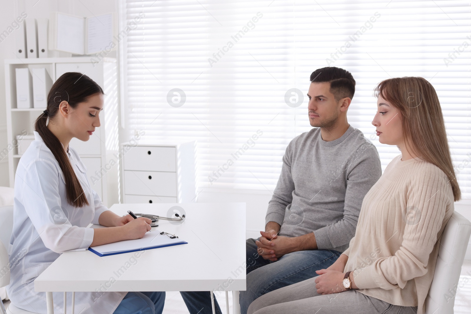 Photo of Couple having appointment with STD specialist in clinic