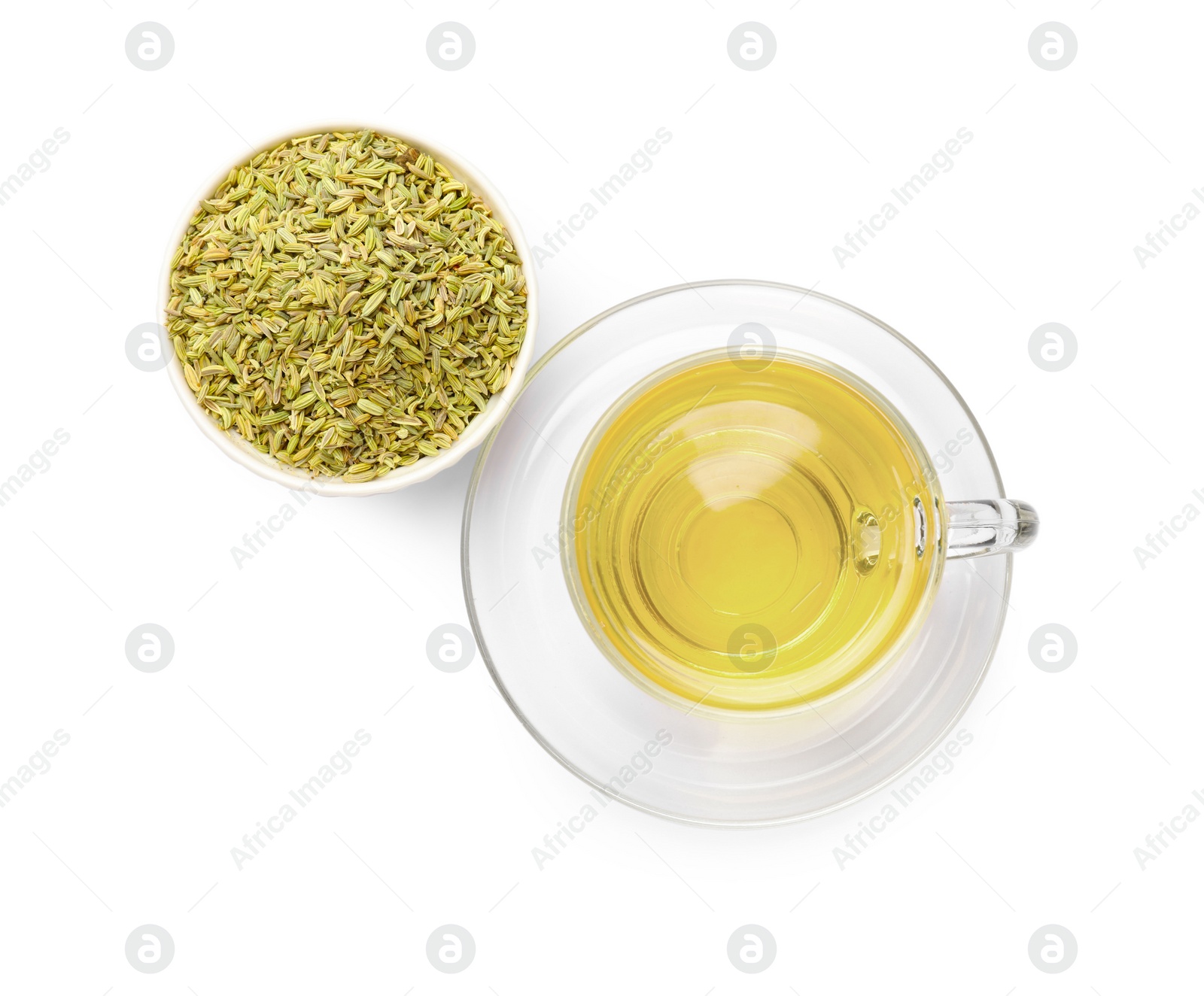 Photo of Aromatic fennel tea in cup and seeds isolated on white, top view