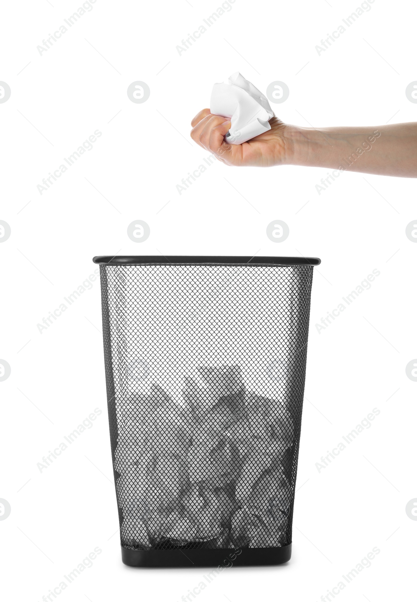 Image of Woman holding crumpled sheets of paper over trash bin, collage 