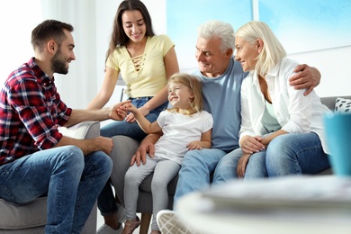 Photo of Happy family at home. Reunion of generations