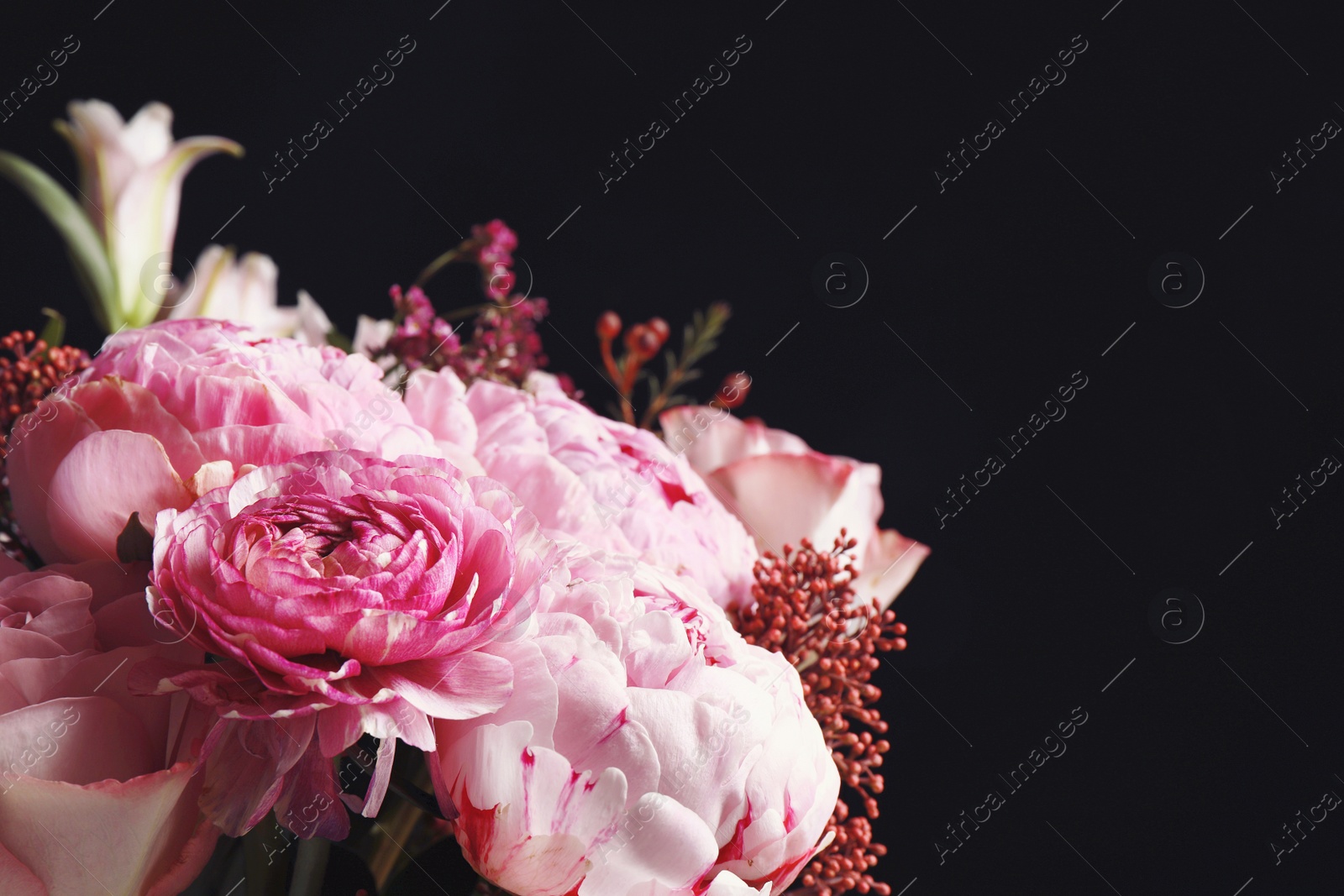 Photo of Beautiful bouquet of different flowers on black background, closeup. Floral card design with dark vintage effect