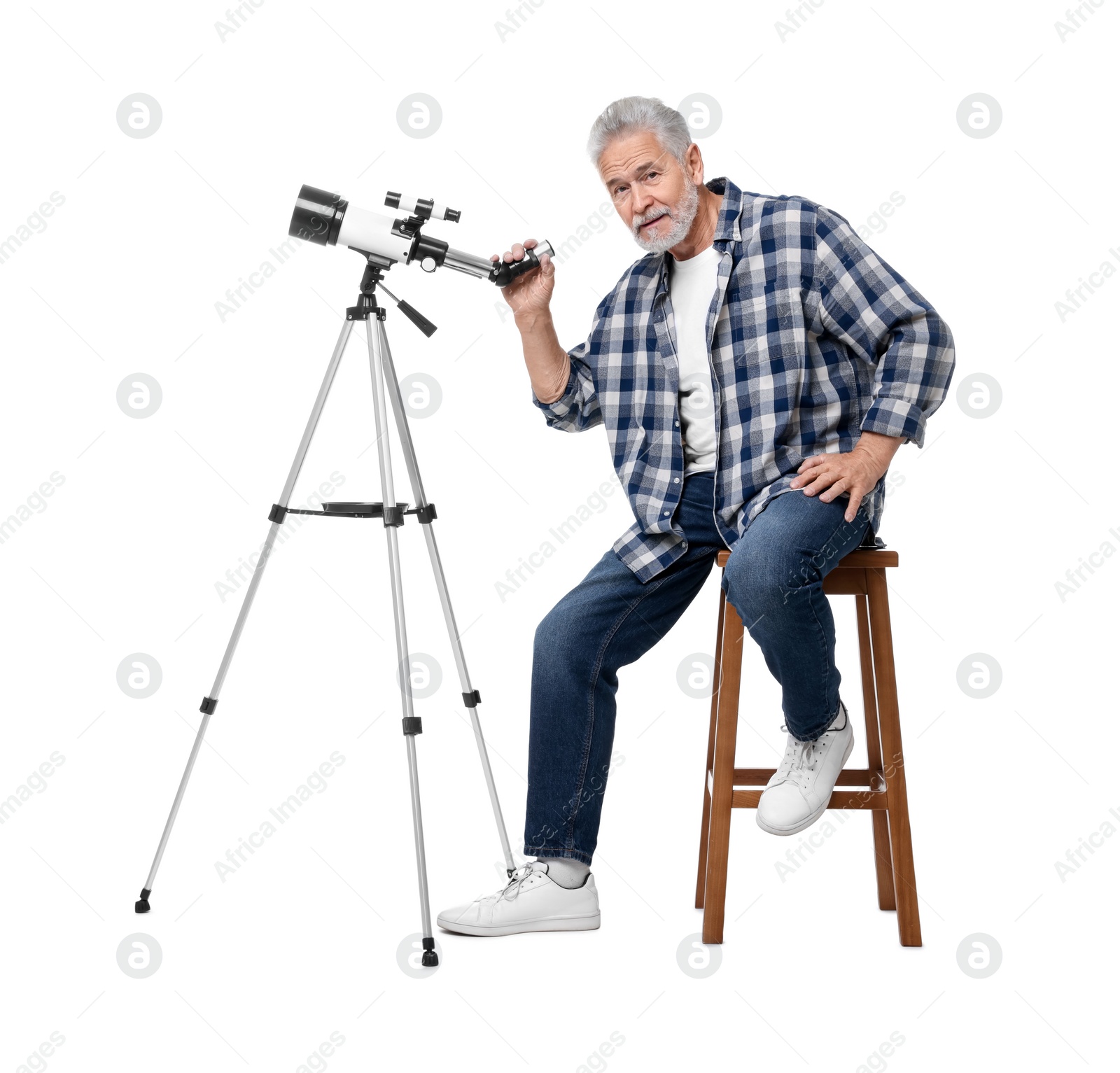 Photo of Senior astronomer with telescope on white background