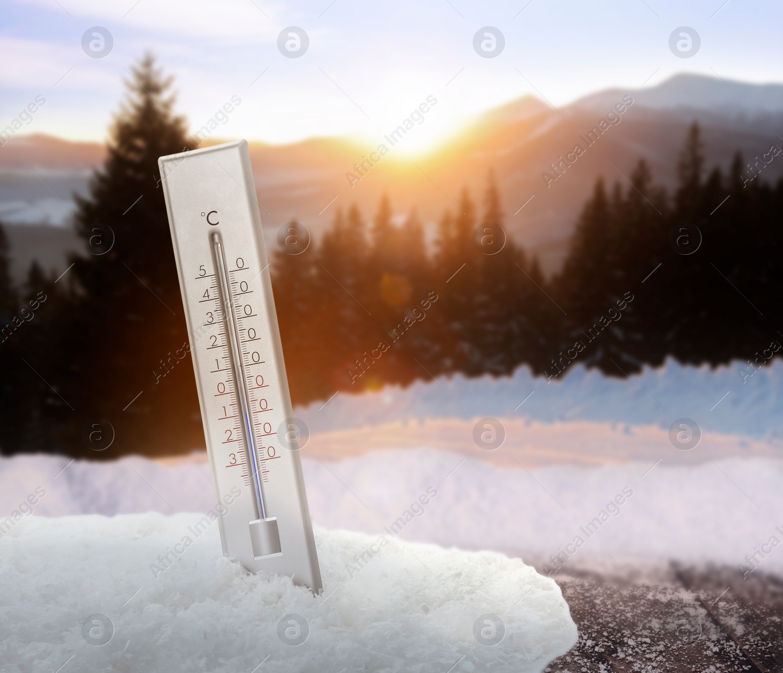 Image of Thermometer in snow showing temperature below zero outdoors on winter day