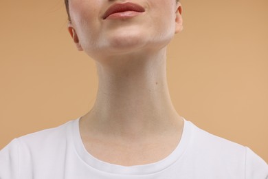 Beauty concept. Woman on beige background, closeup