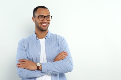 Portrait of handsome young man on white background, space for text