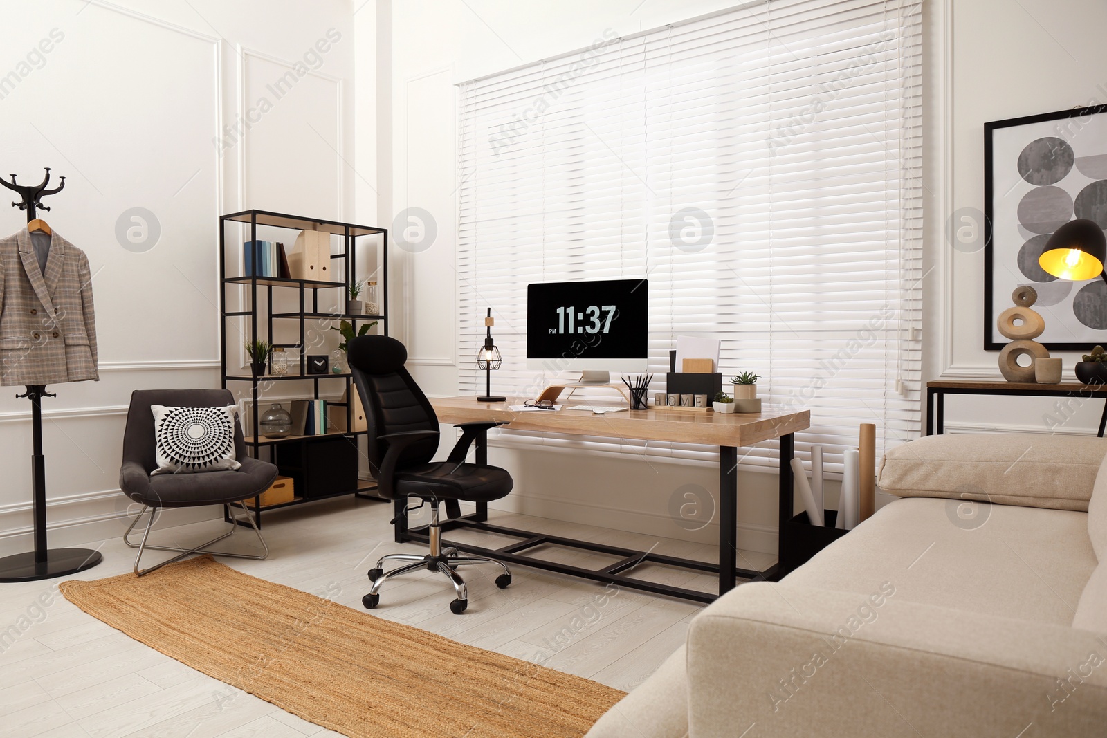 Photo of Home office interior with comfortable workplace near window