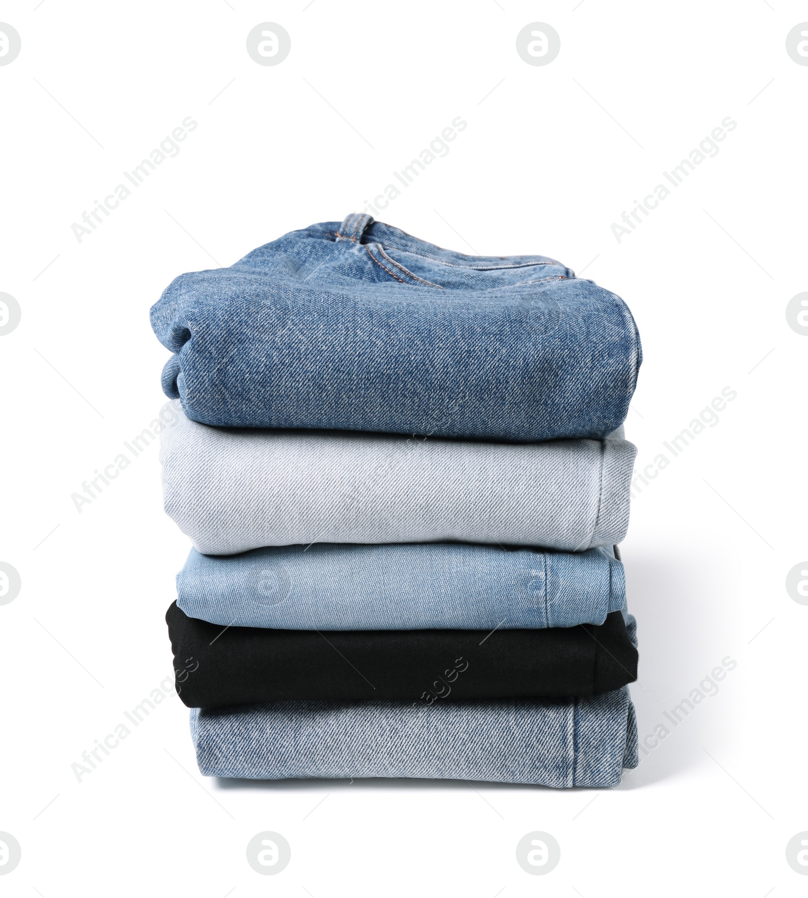 Image of Stack of different folded jeans isolated on white