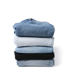 Image of Stack of different folded jeans isolated on white