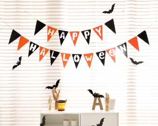 Photo of Stylish room interior with festive Halloween decor