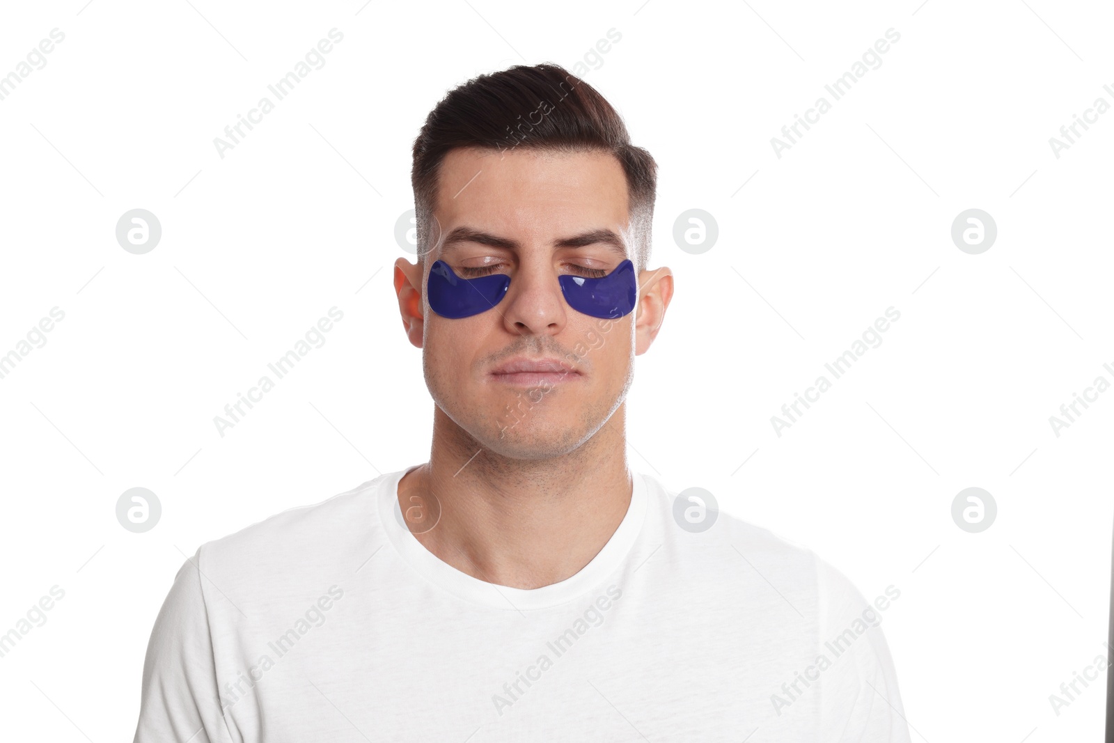 Photo of Man with blue under eye patches on white background