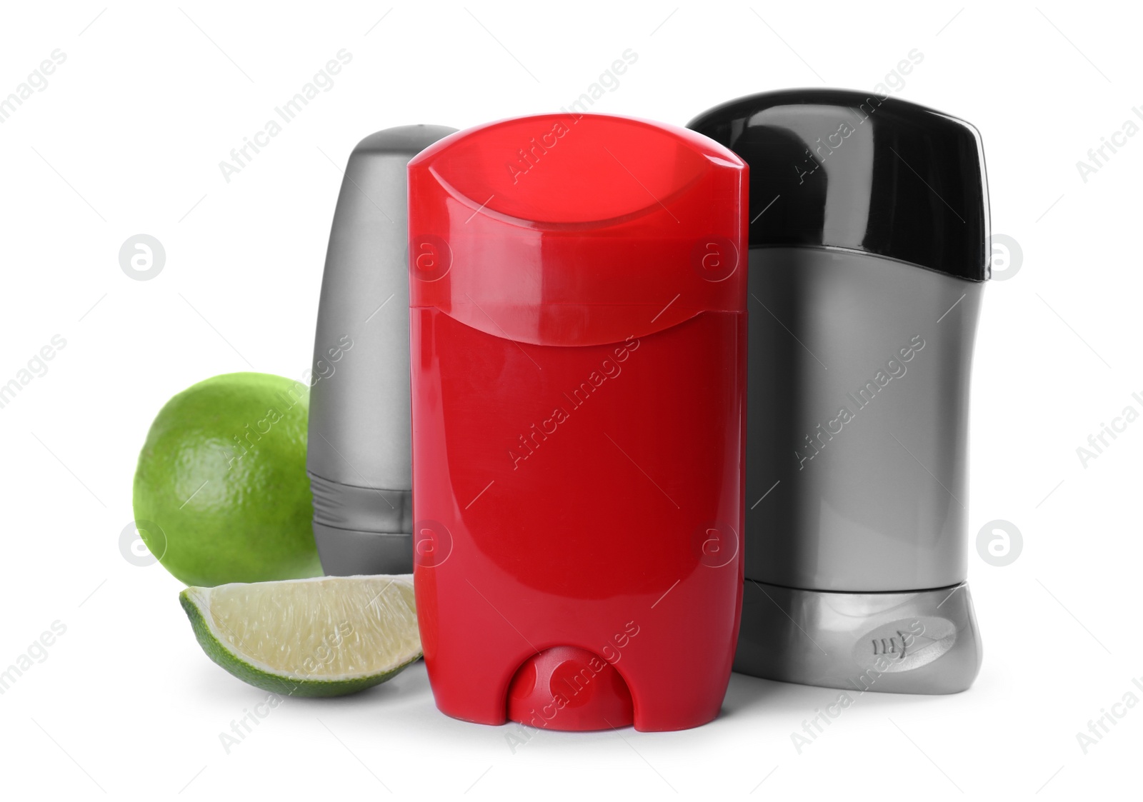 Photo of Different natural male deodorants and lime on white background. Skin care