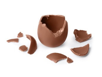 Photo of Tasty broken chocolate egg isolated on white