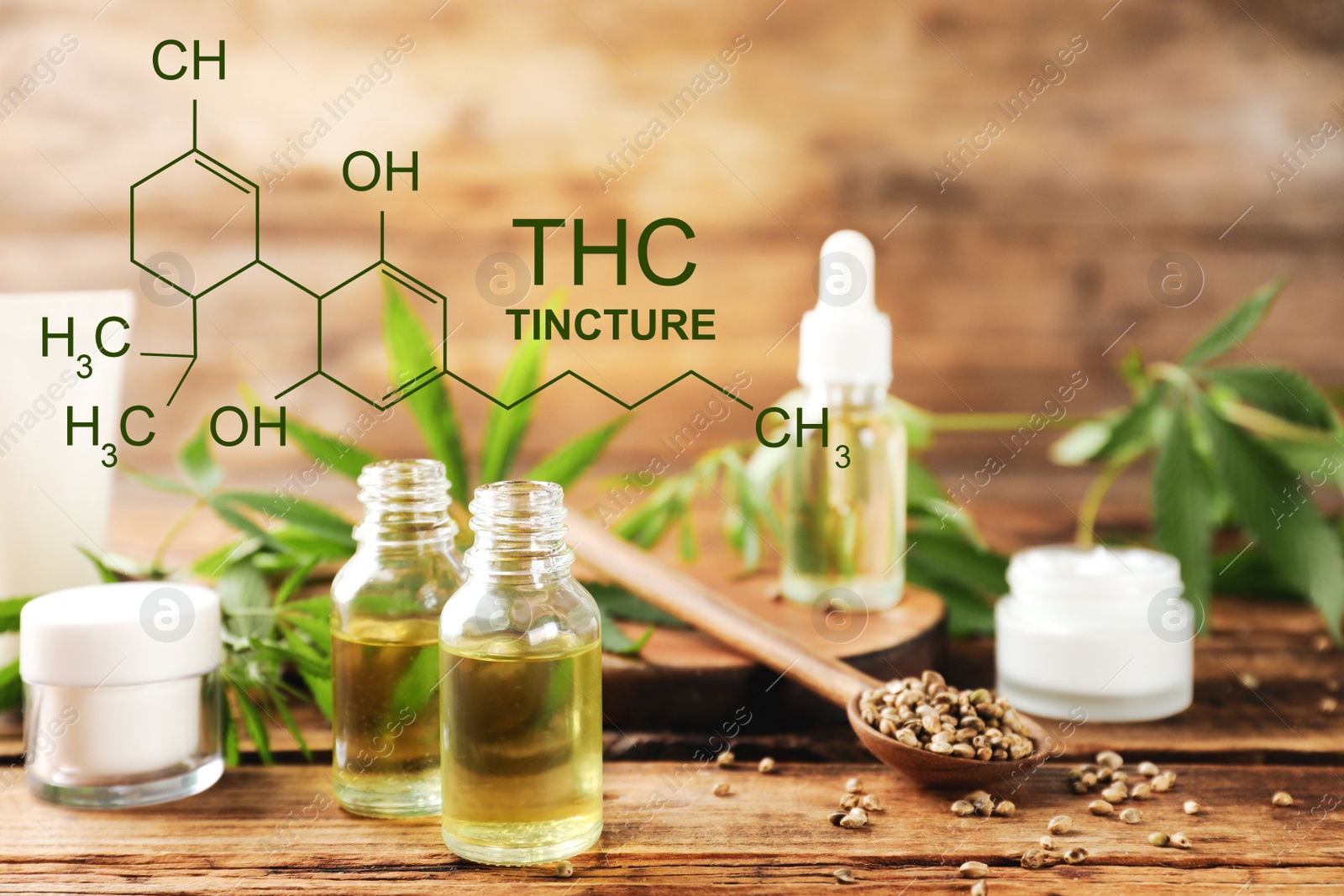 Image of Composition with CBD oil and hemp leaves on wooden table