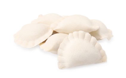 Heap of raw dumplings (varenyky) with tasty filling on white background