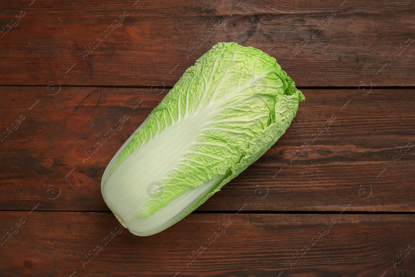 Photo of Fresh ripe Chinese cabbage on wooden table