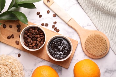 Flat lay composition with natural body scrub and fresh ingredients on white marble table. Anti cellulite treatment