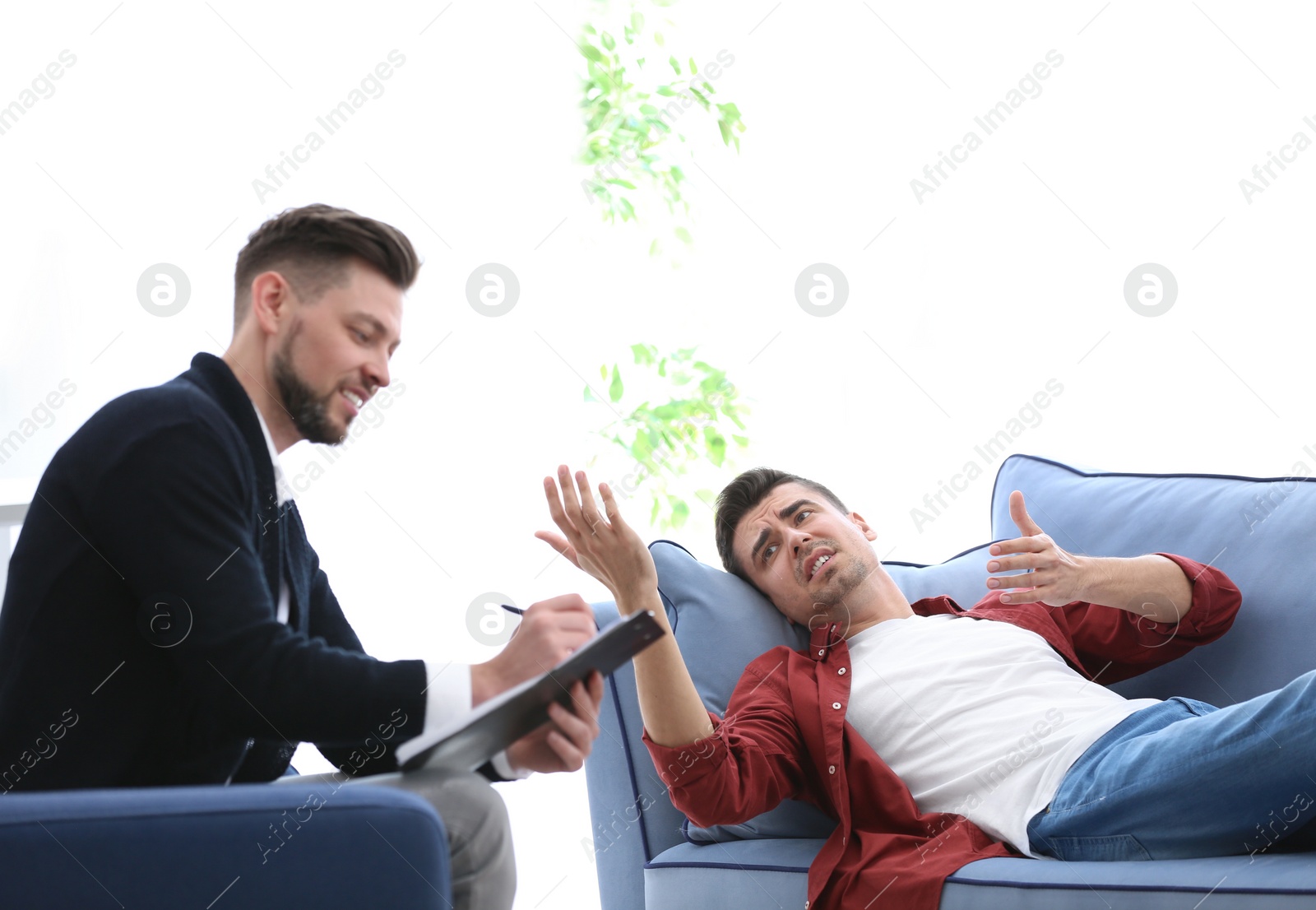 Photo of Male psychologist with client in office