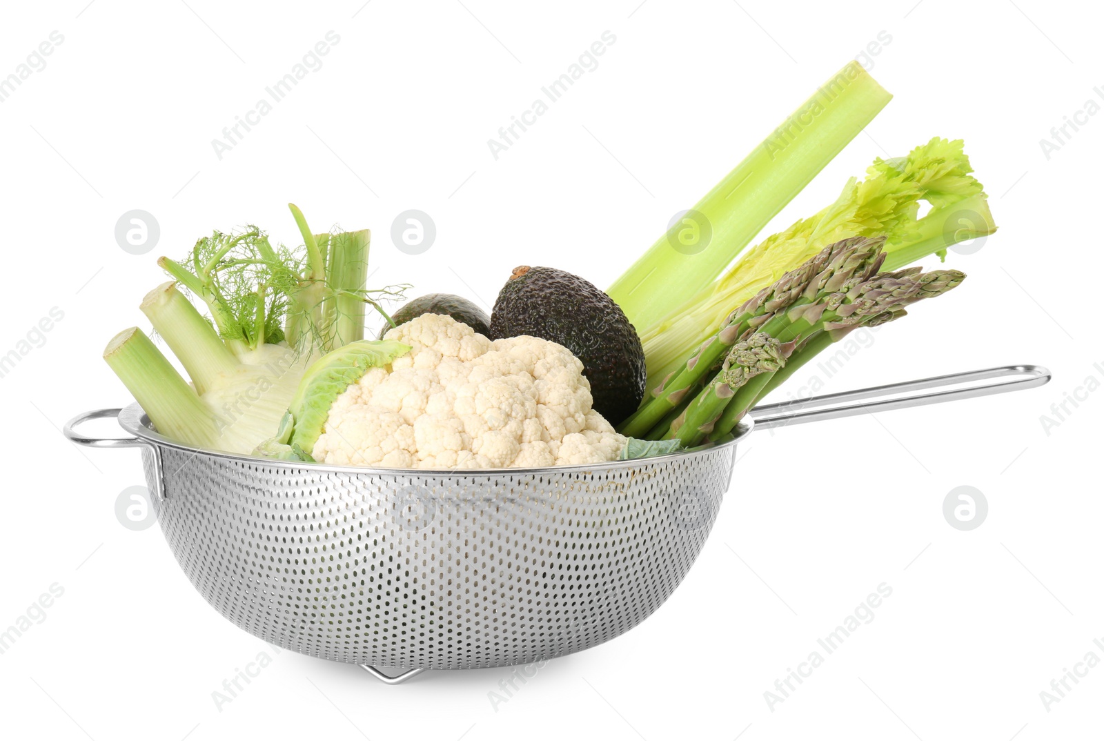 Photo of Metal colander with different vegetables and avocados isolated on white