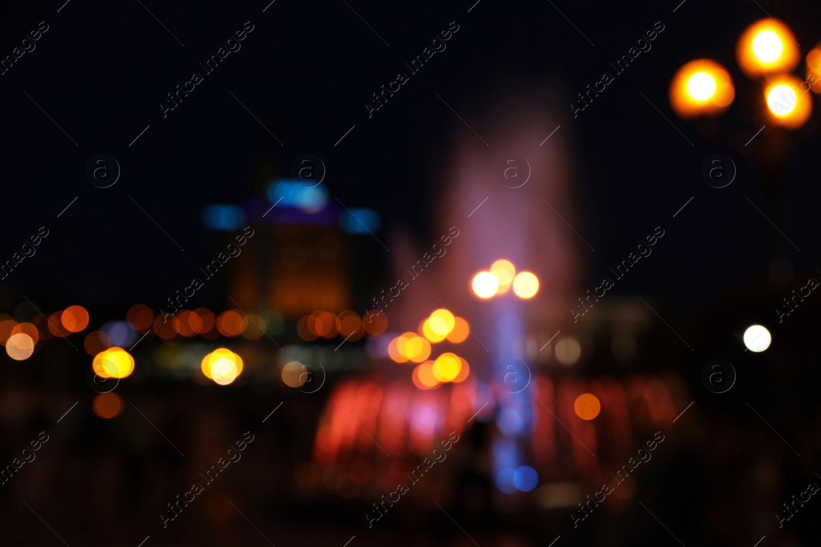 Photo of Blurred view of beautiful city at night. Bokeh effect