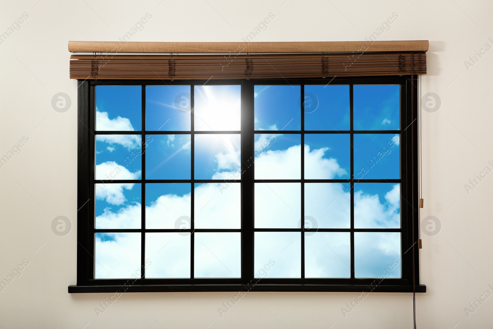 Image of Beautiful view on blue sky with clouds through window