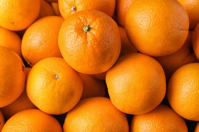 Photo of Pile of fresh ripe oranges as background, top view