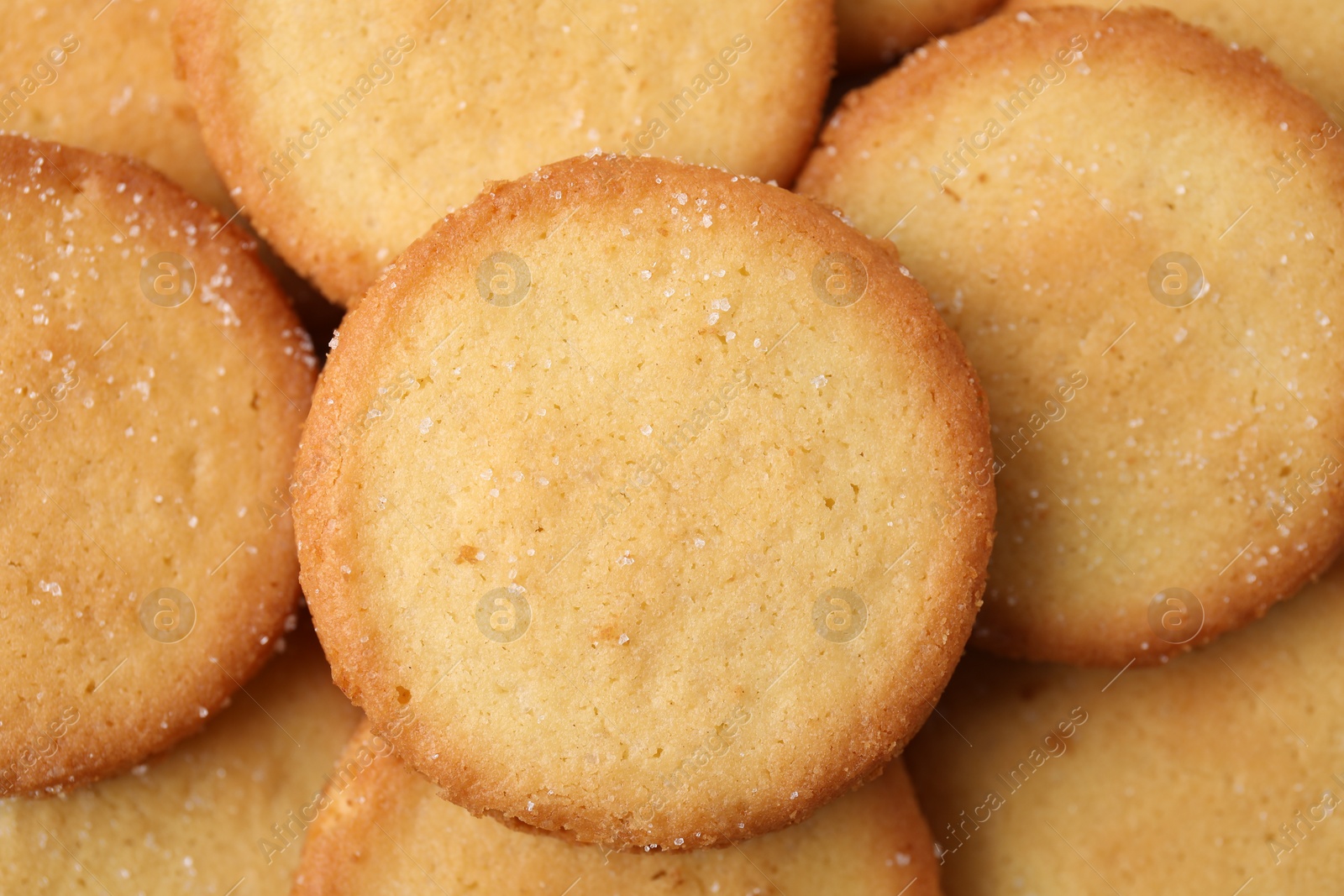 Photo of Tasty sweet sugar cookies as background, top view