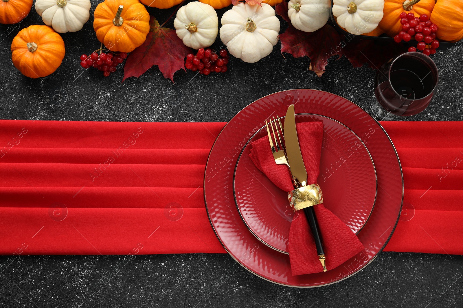 Photo of Happy Thanksgiving day. Beautiful table setting and autumn decoration on black background, flat lay