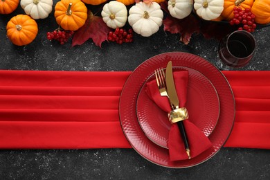 Photo of Happy Thanksgiving day. Beautiful table setting and autumn decoration on black background, flat lay