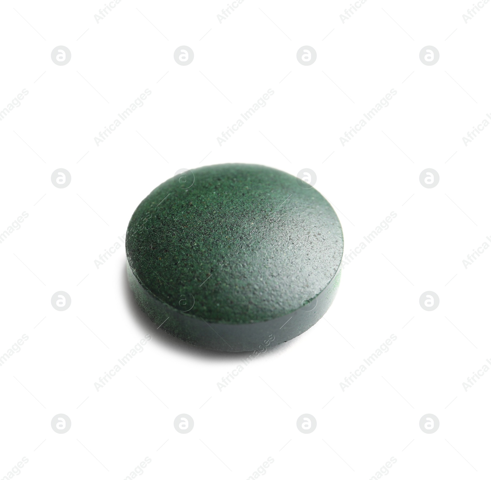 Photo of Spirulina tablet on white background. Healthy lifestyle