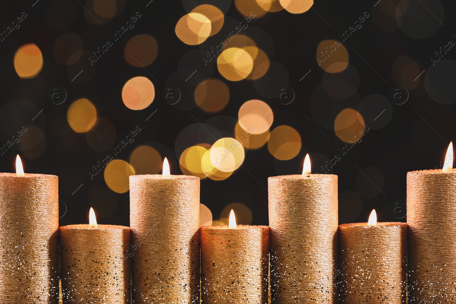 Image of Burning candles on dark background, bokeh effect