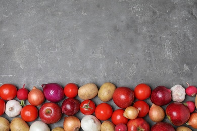 Ripe apples and vegetables on stone surface, flat lay. Space for text