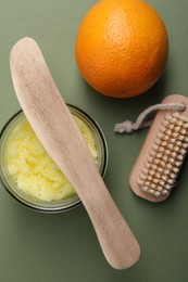 Flat lay composition with natural body scrub on olive background. Anti cellulite treatment