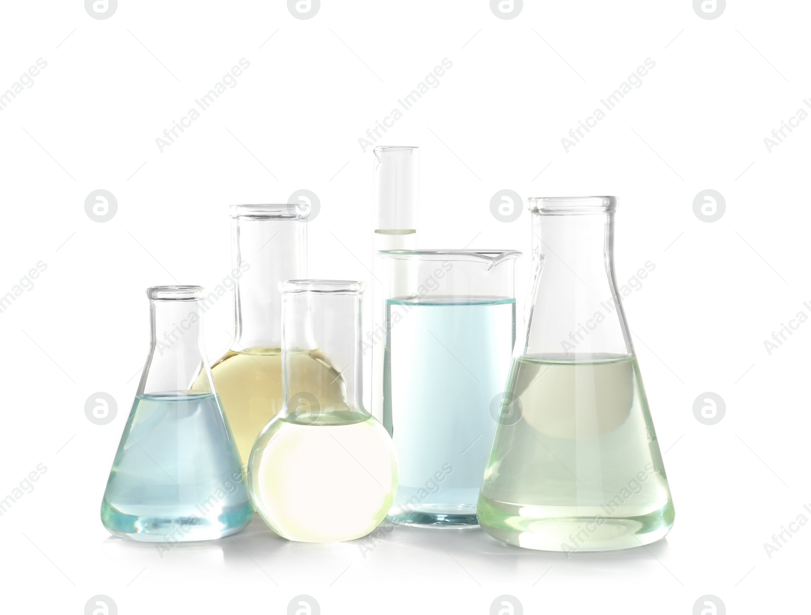 Photo of Laboratory glassware with liquid on white background. Chemical analysis