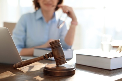 Gavel on table and lawyer in office