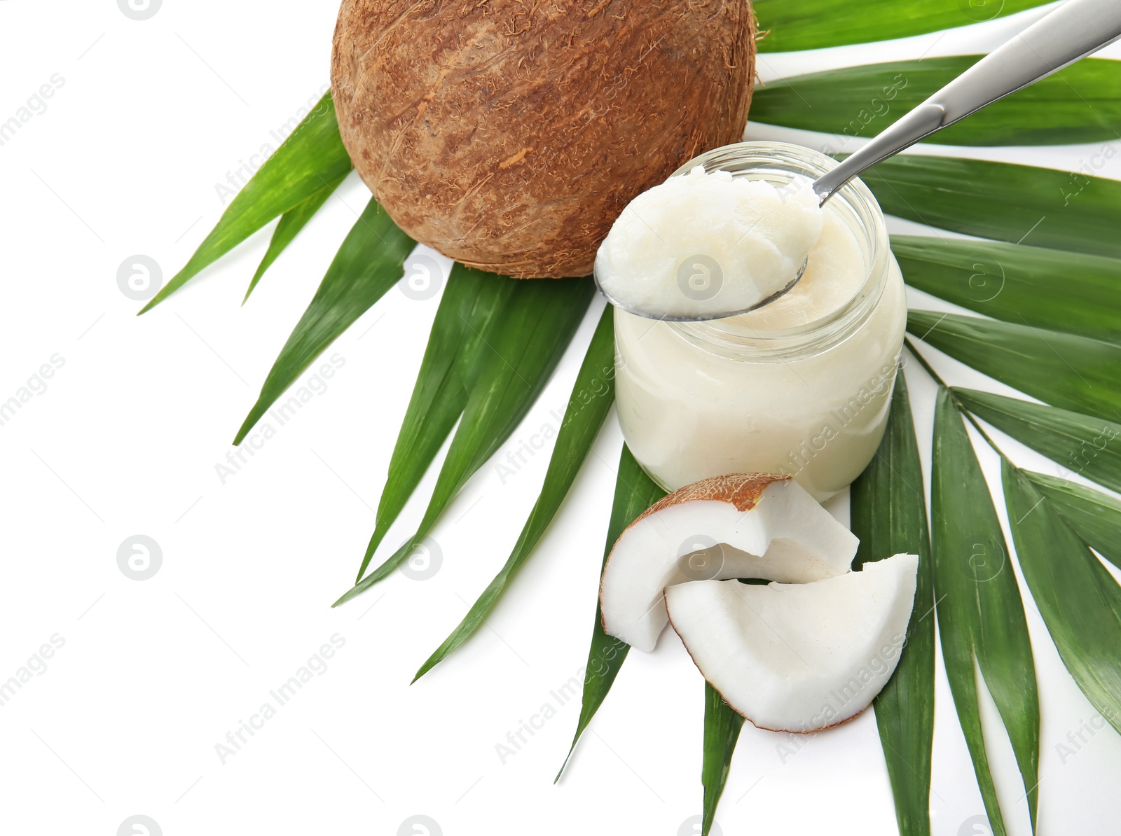 Photo of Beautiful composition with coconut oil and nuts on white background