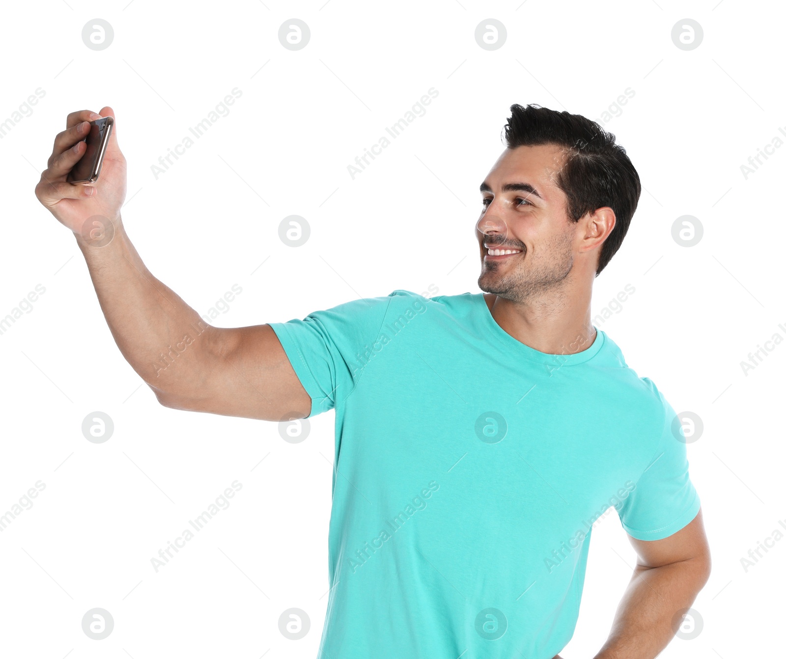 Photo of Happy young man taking selfie on white background