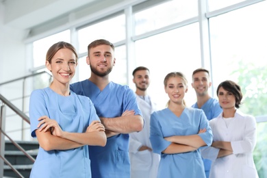 Photo of Team of doctors in uniform at workplace