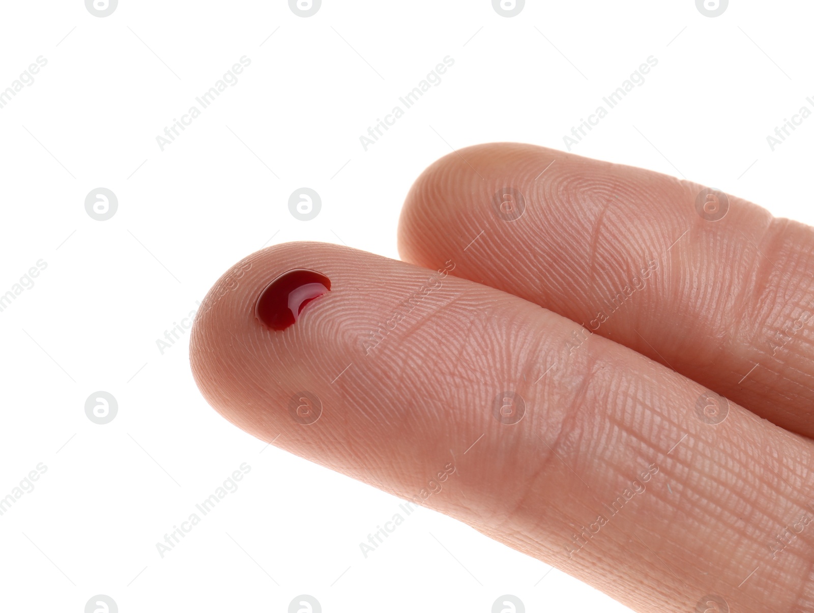 Photo of Woman with pricked finger and blood drop on white background, closeup