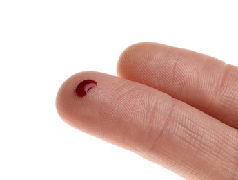 Photo of Woman with pricked finger and blood drop on white background, closeup