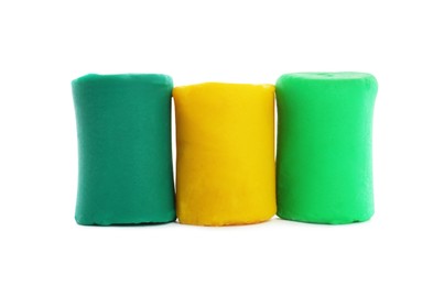 Photo of Different colorful play dough on white background