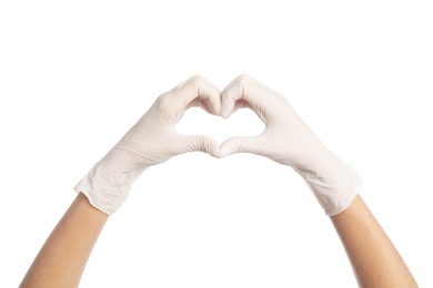 Doctor in medical gloves showing heart with hands on white background, closeup