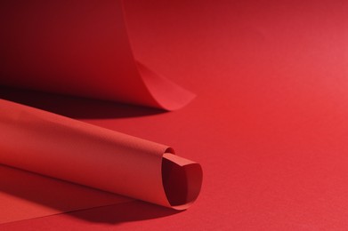 Photo of Paper sheets on red background, space for text