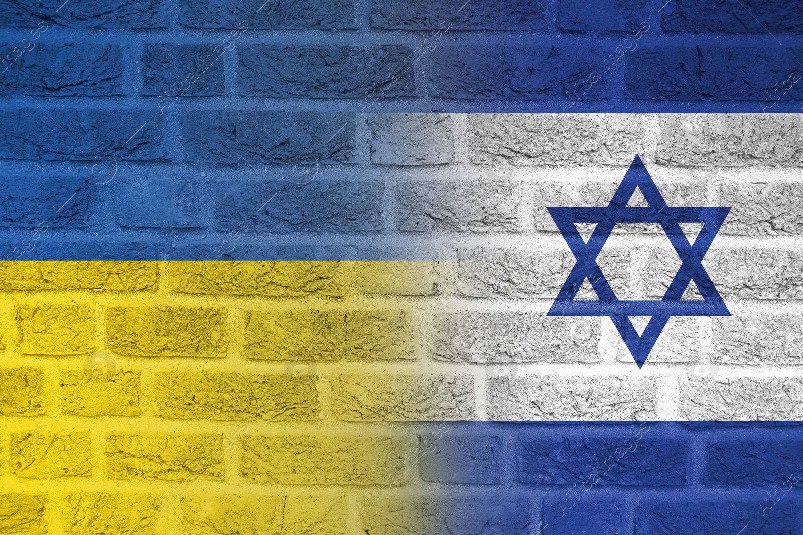 Image of Flags of Ukraine and Israel on brick wall. International diplomatic relationships