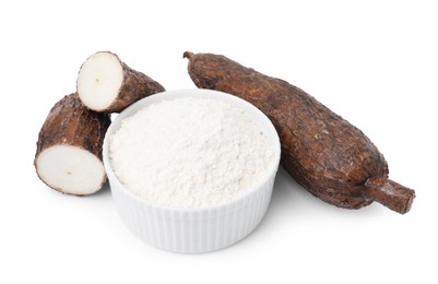 Bowl with cassava flour and roots isolated on white