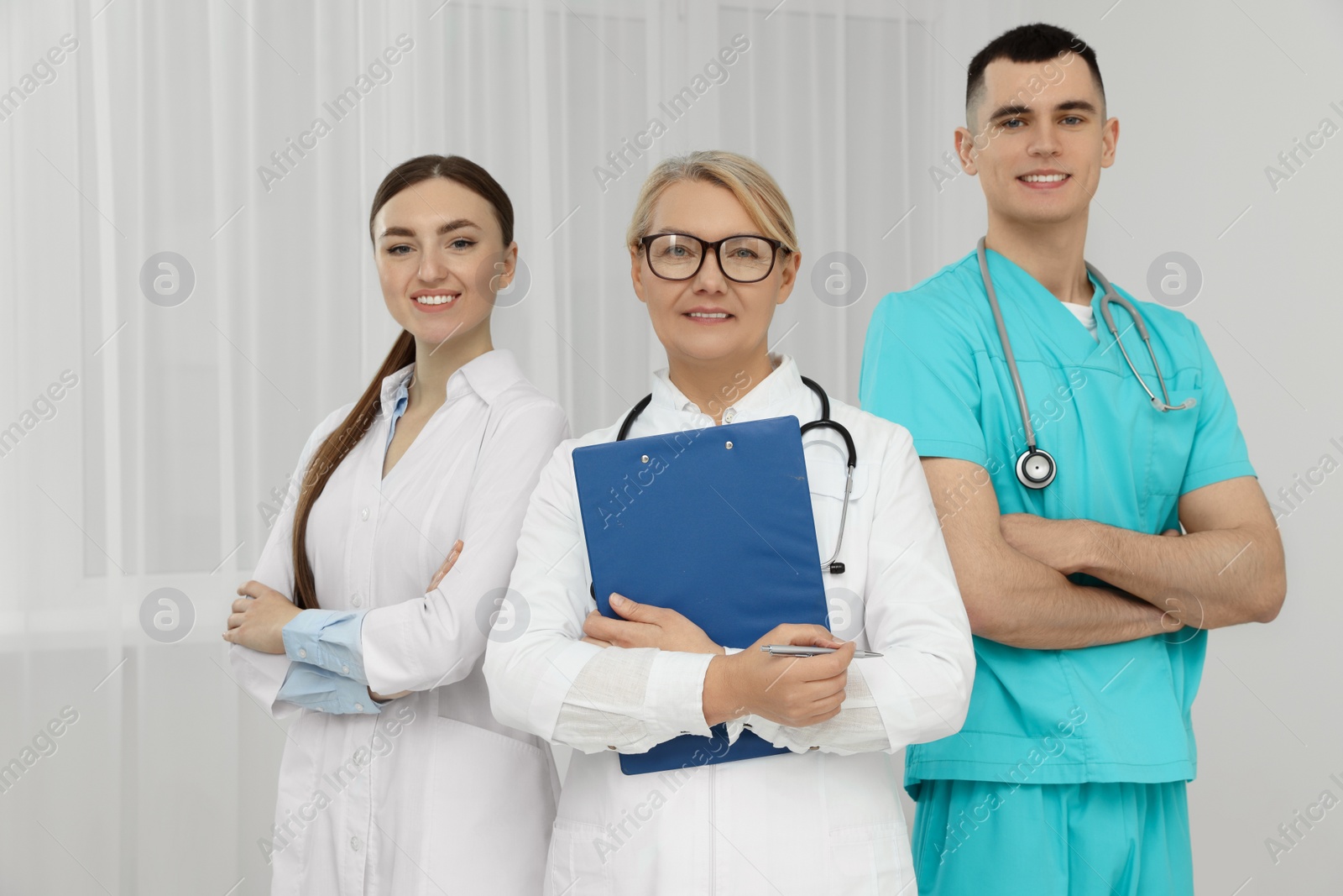 Photo of Portrait of medical doctors wearing uniforms indoors